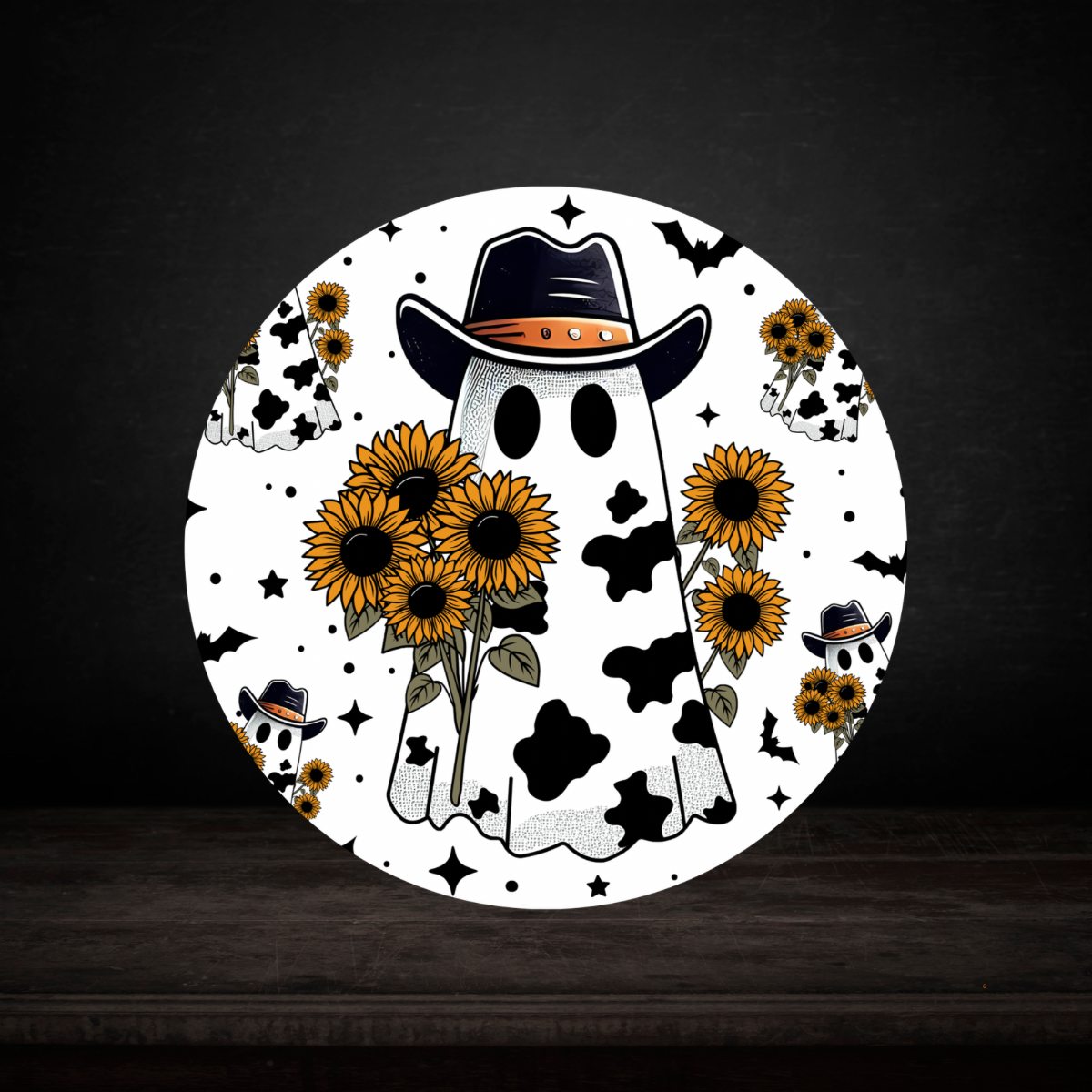 Round coaster with a ghost wearing a cowboy hat, surrounded by sunflowers on a dark background.