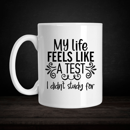 White mug with black text on a dark background